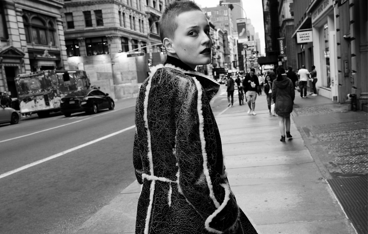 Lina Hoss wears coat by Véronique Leroy. Sweater by Wolford.