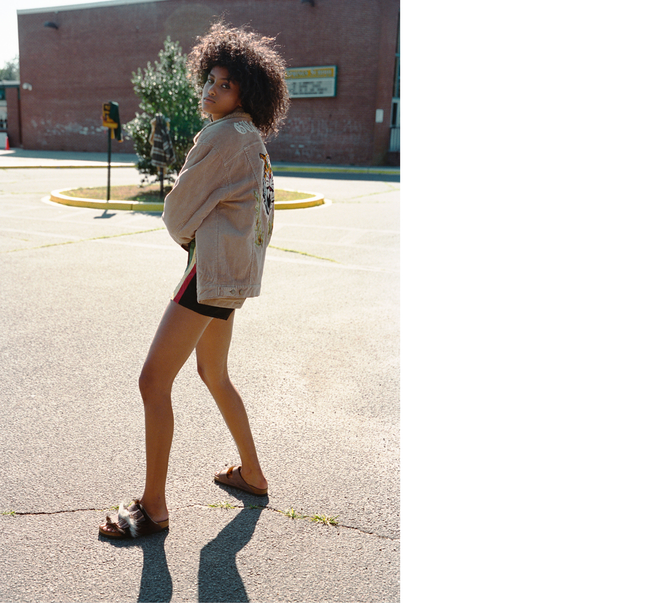 Jacket by Gucci. Vintage shorts from Southpaw Vintage, New York. Sandals by Birkenstock.