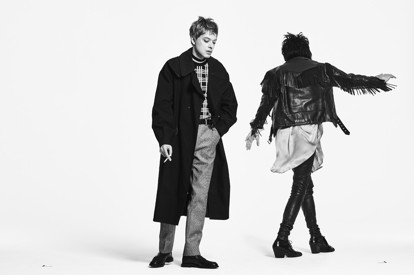 From left, Hooky wears vintage coat from Early Halloween, New York. Sweater, trousers, and shoes by Fendi. Orion wears vintage jacket from What Goes Around Comes Around, New York. Shirt by Ann Demeulemeester. Trousers, vintage Vivienne Westwood boots, and earring, stylist's own.