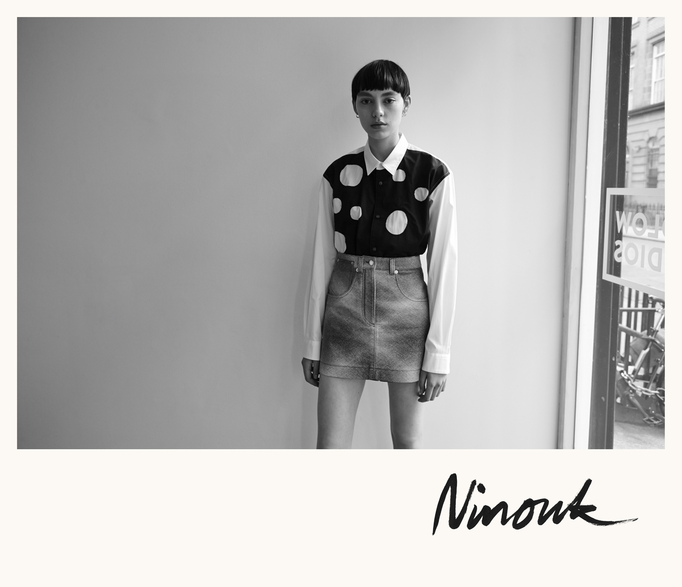 Ninouk Akkerman at Wilhelmina Models wears shirt by Comme des Garçons Shirt. Skirt by Louis Vuitton. Earrings, model's own.