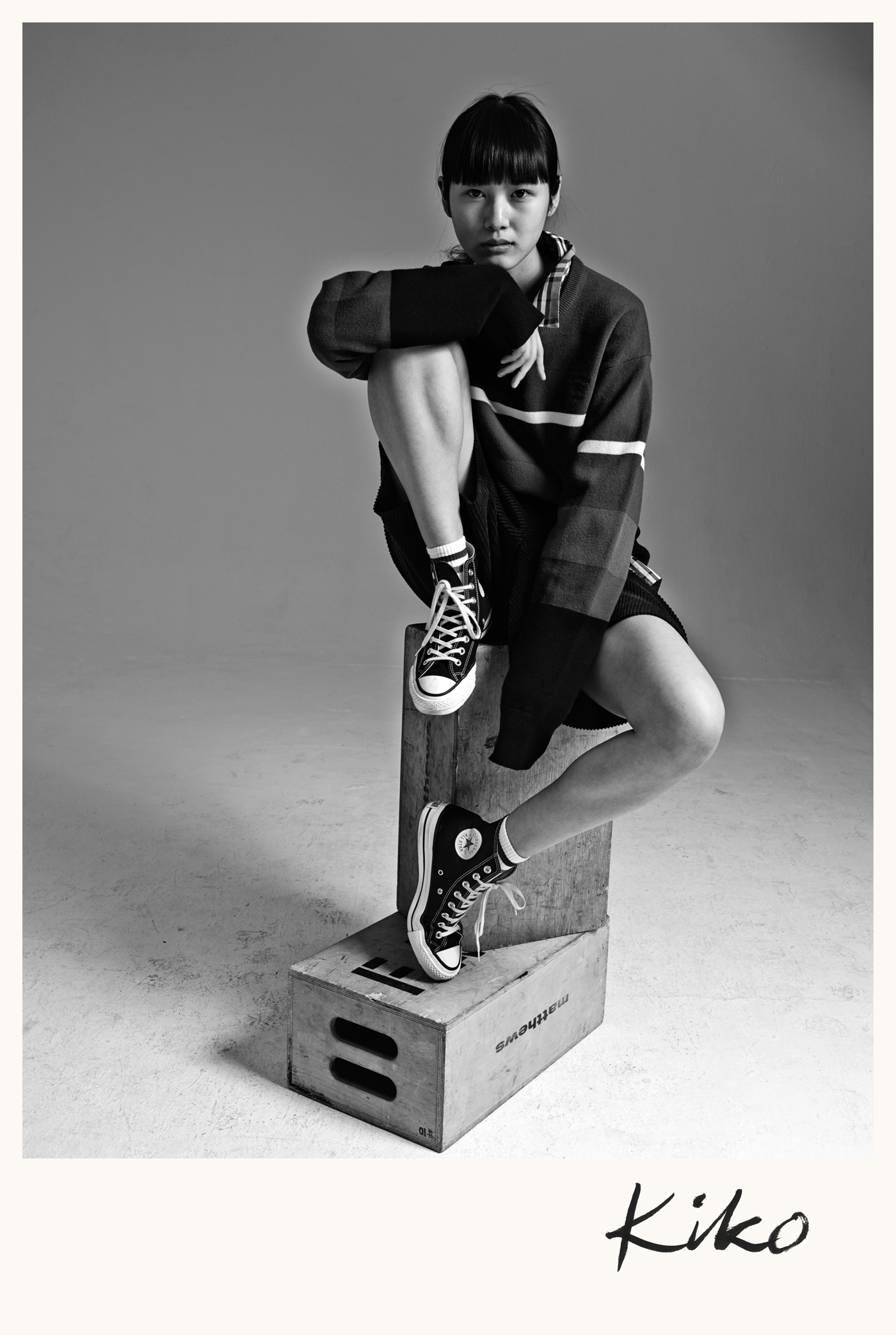 Kiko Arai at Muse Management wears sweater and shirt by Burberry. Shorts and sneakers, model's own. Socks by Topshop.