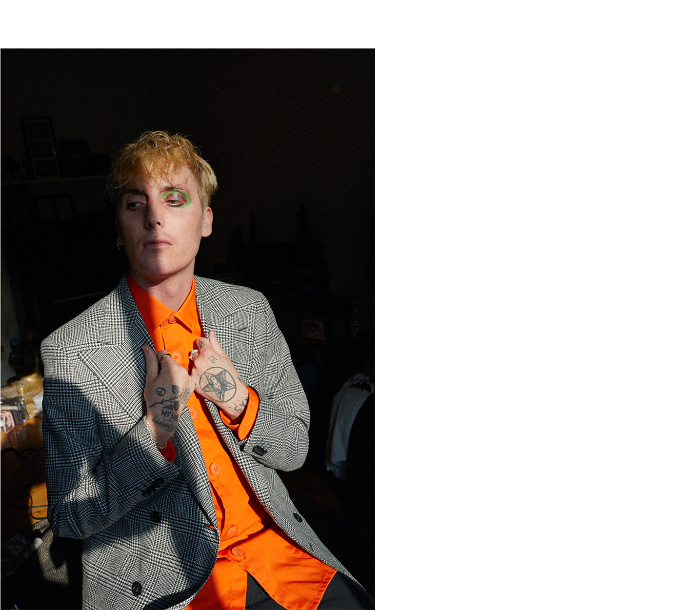 Jacket by Oscar Jacobson. Top by Schnayderman’s. Trousers by Acne Studios. Bracelet, talent's own. Rings by All Blues.