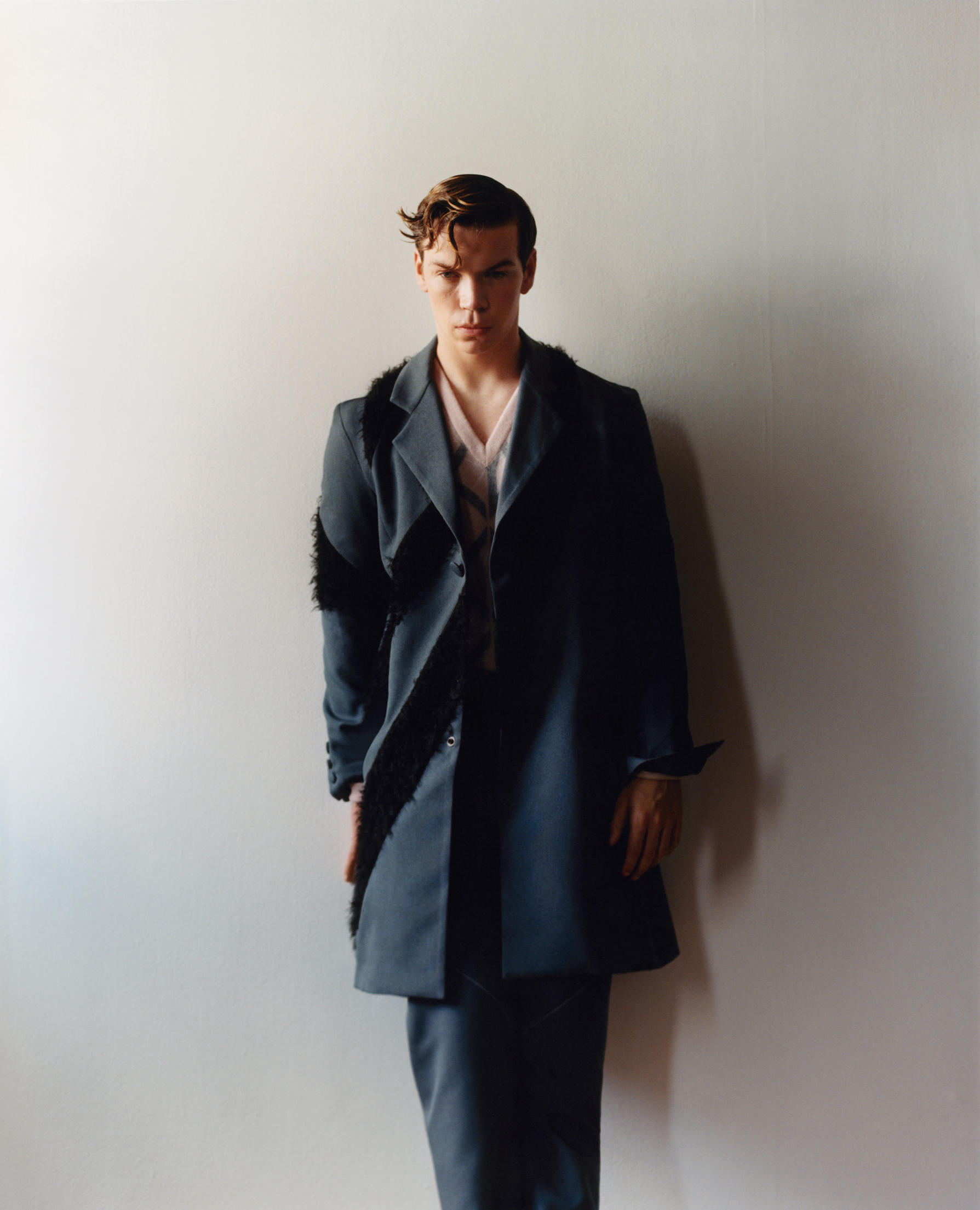 Coat and trousers by Kiko Kostadinov. Sweater by Dior Men.